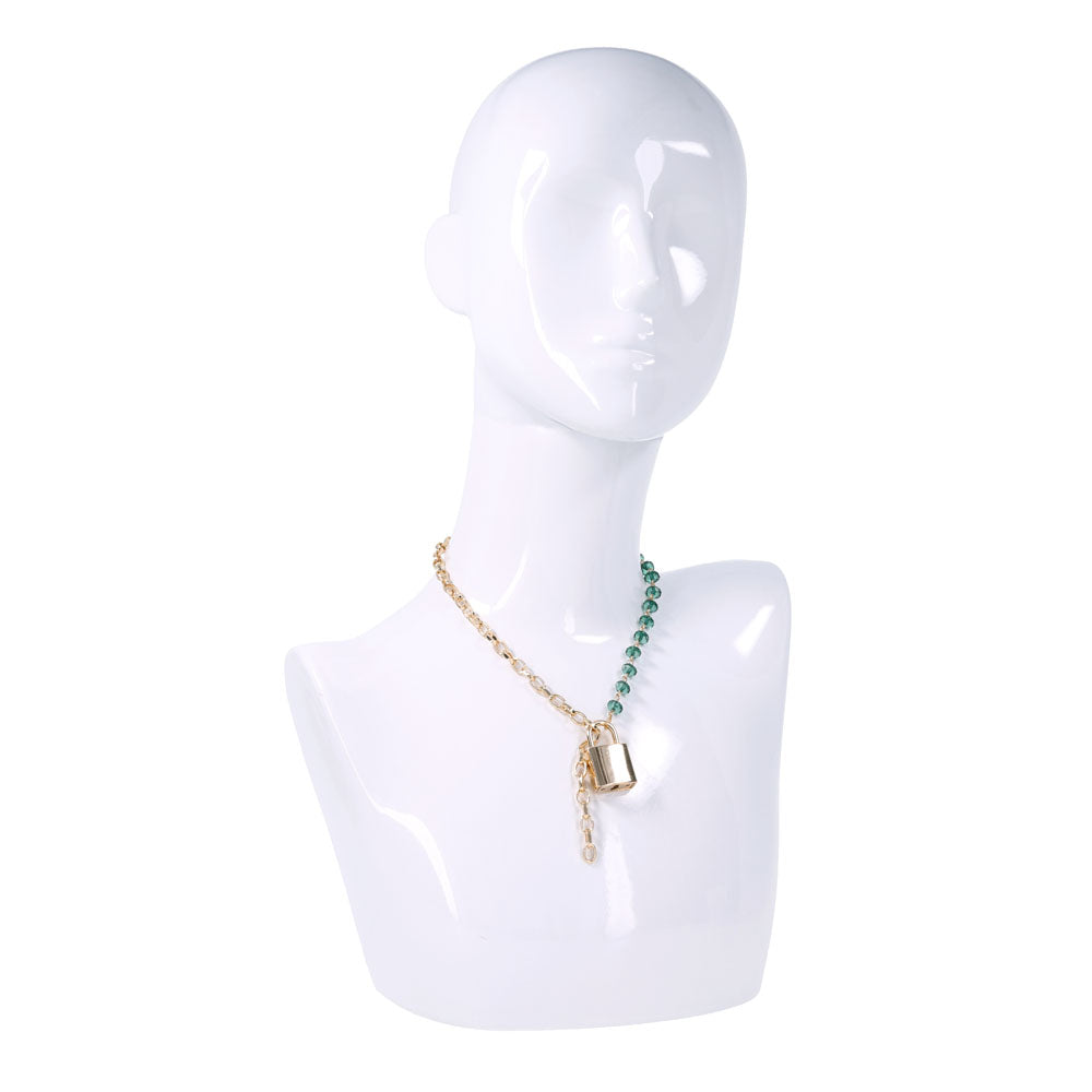Sex & Mischief Indica Crystal Day Collar - Gold/Emerald Lockable Collar displayed on a mannequin with green gem accents.
