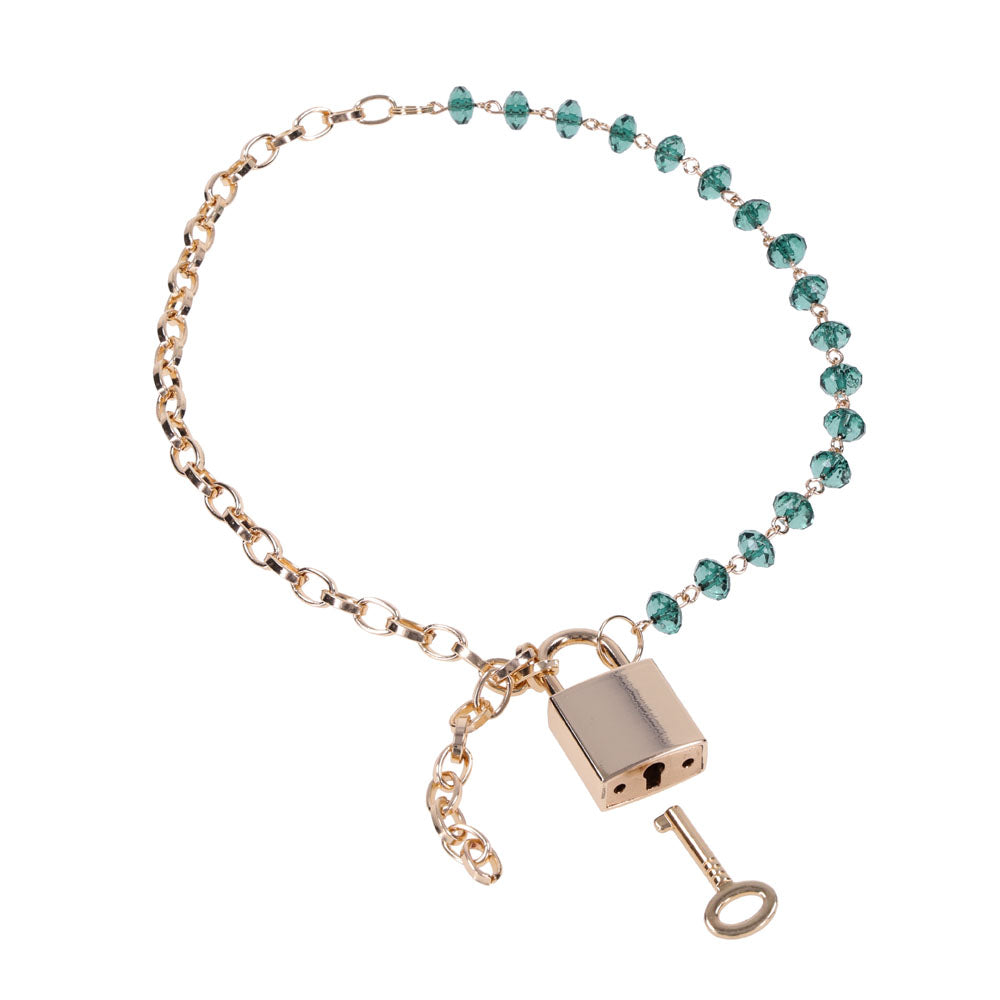Sex & Mischief Indica Crystal Day Collar - Gold/Emerald Lockable Collar with green gem accents and gold chain.