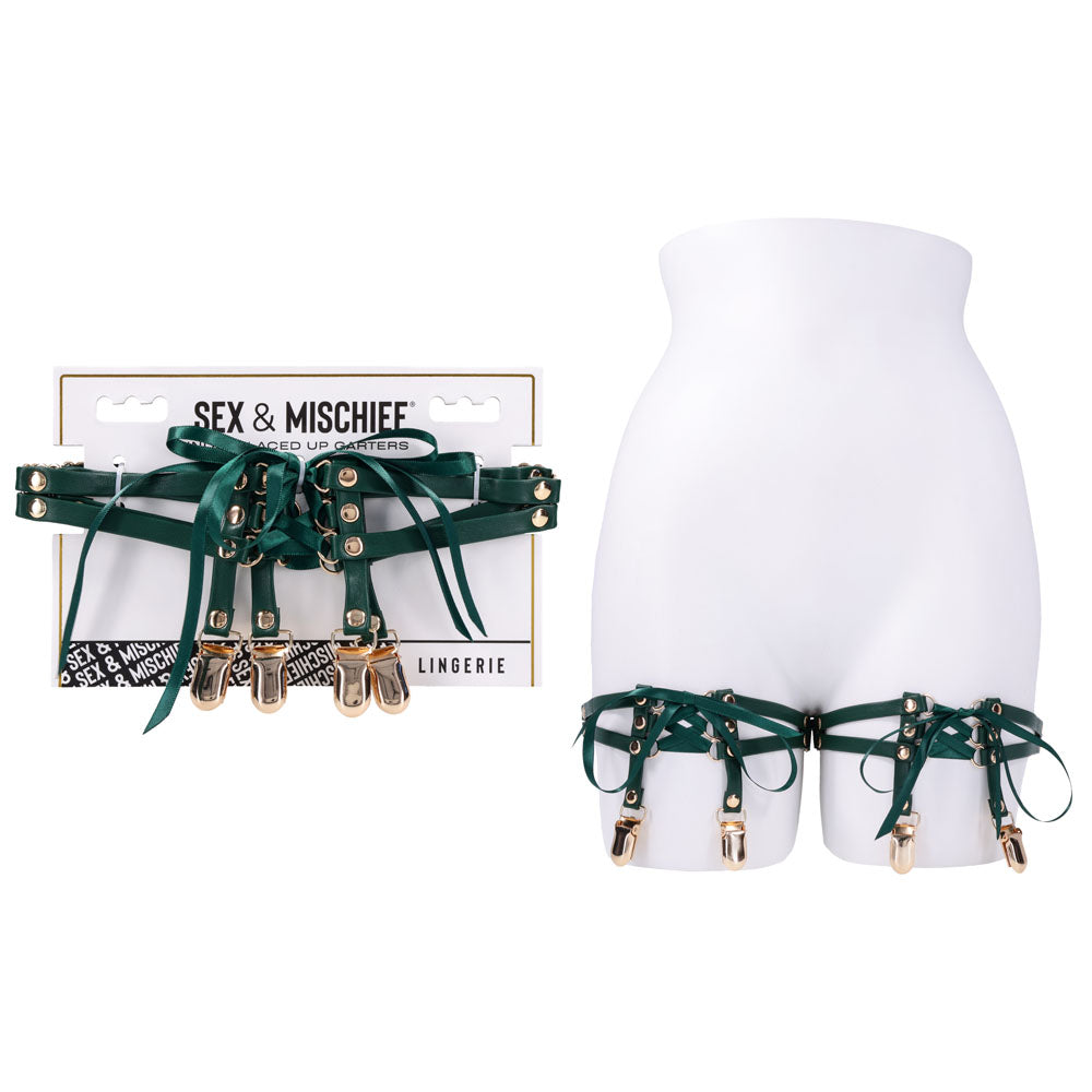 Sex & Mischief Indica Laced Up Garters - /Gold Garters - Set of 2 displayed on a mannequin with emerald faux leather and gold clips.