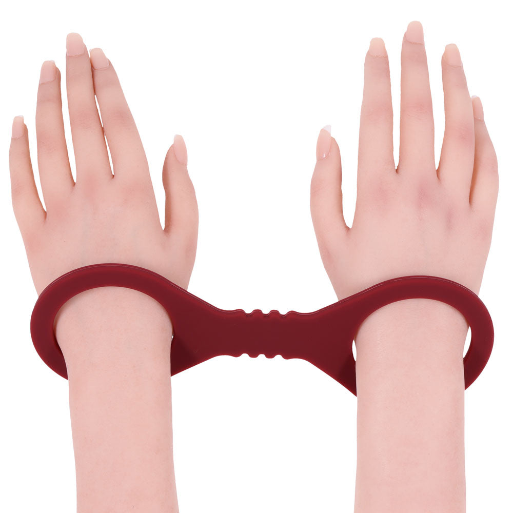 Sex & Mischief Enchanted Small Silicone Cuffs - Burgundy Small Restraints with a smooth grip for intimate moments.
