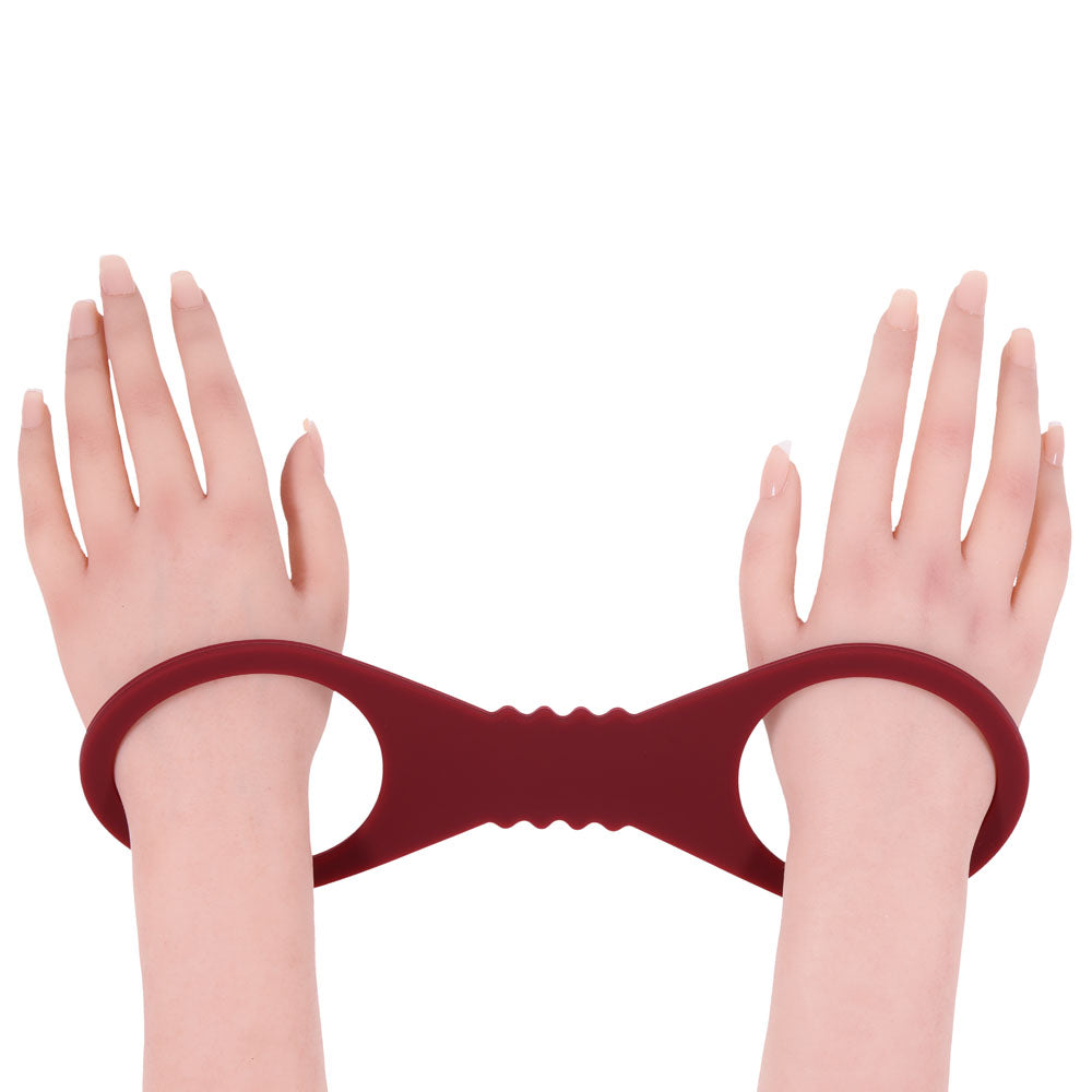 Sex & Mischief Enchanted Large Silicone Cuffs - Burgundy Large Restraints showcasing comfortable restraint for intimate play.