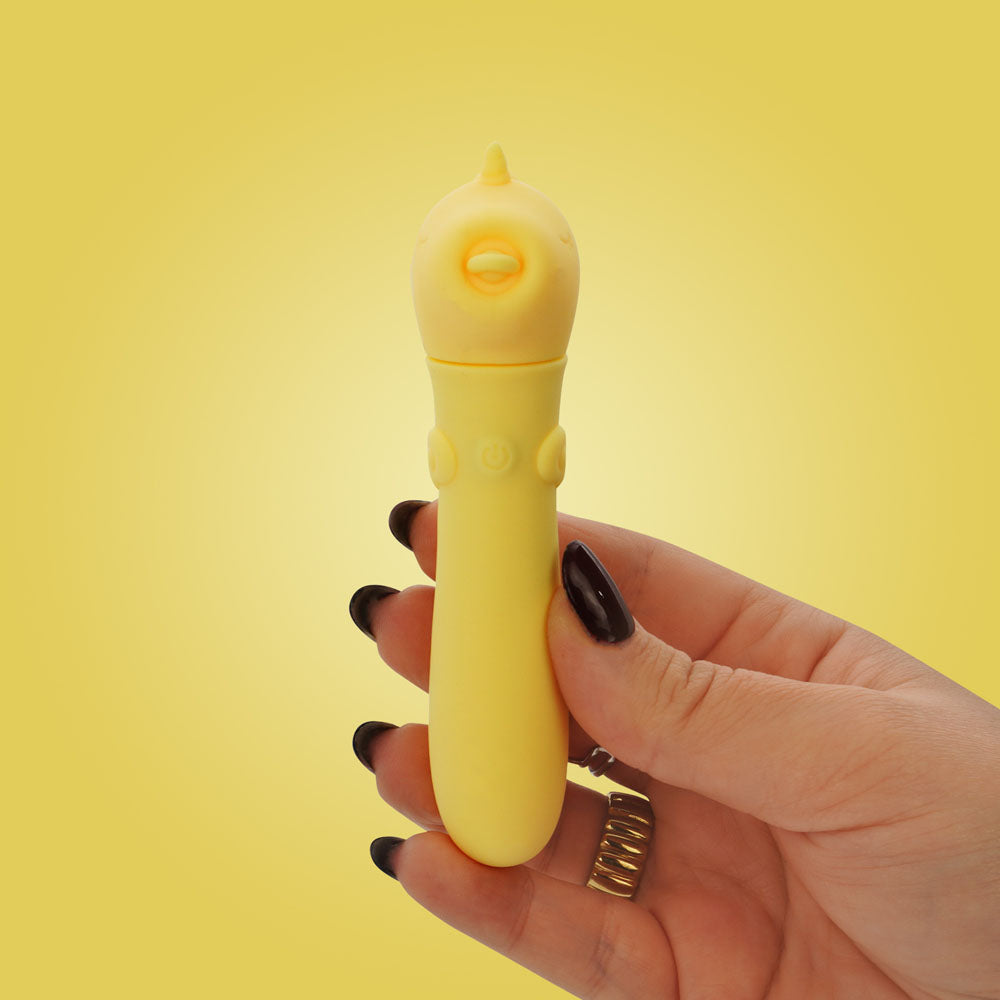Unihorn - USB Bullet - Bean Blossom - USB Rechargeable Vibrating Bullet held in hand against a yellow background.