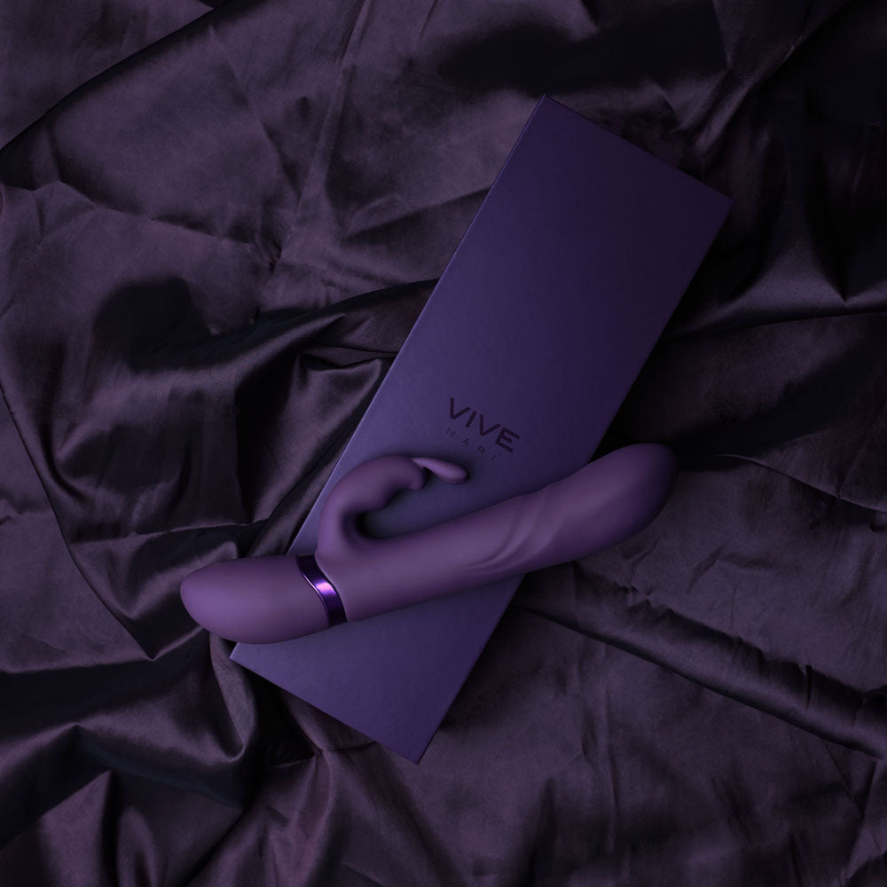 VIVE Nari -  -  24.1 cm USB Rechargeable Rabbit Vibrator on a dark silk background.