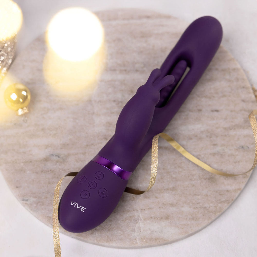 VIVE Mika -  -  23.2 cm USB Rechargeable Rabbit Vibrator with Flapping Shaft on a marble surface.