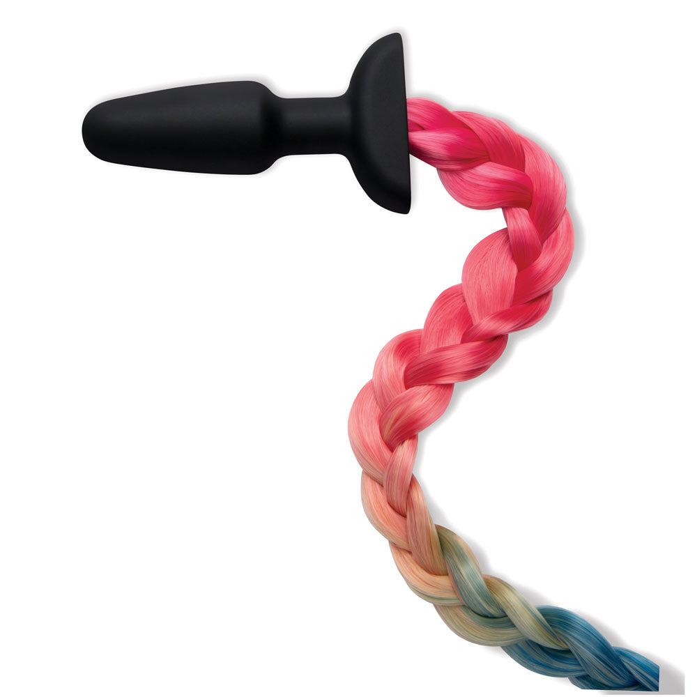 WhipSmart Furry Tales Silicone Rainbow Tail - Black 8.9 cm Butt Plug with Rainbow Tail next to colorful braided hair.