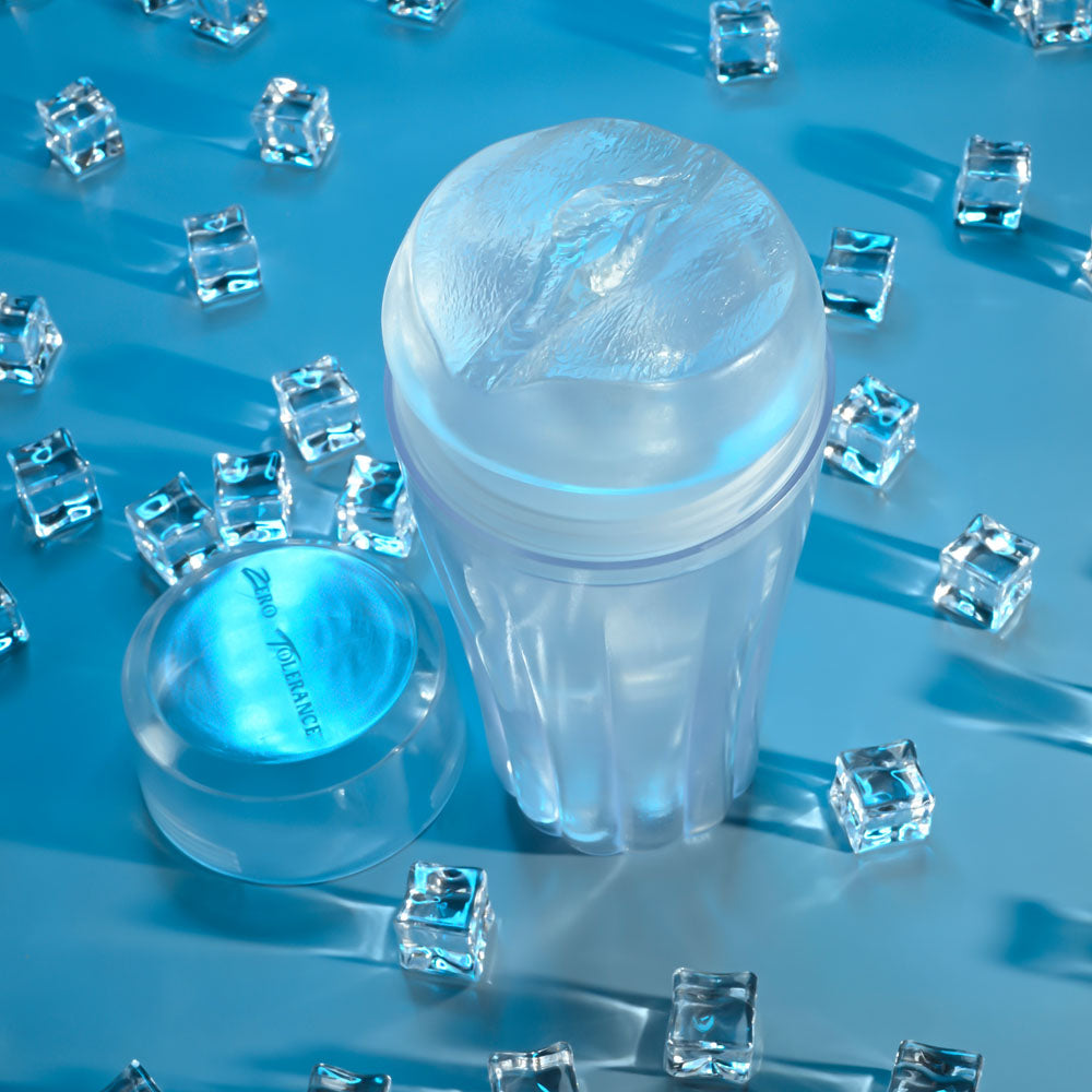 Zero Tolerance THE CHOICE - 21 cm Vagina Stroker surrounded by ice cubes on a blue background.