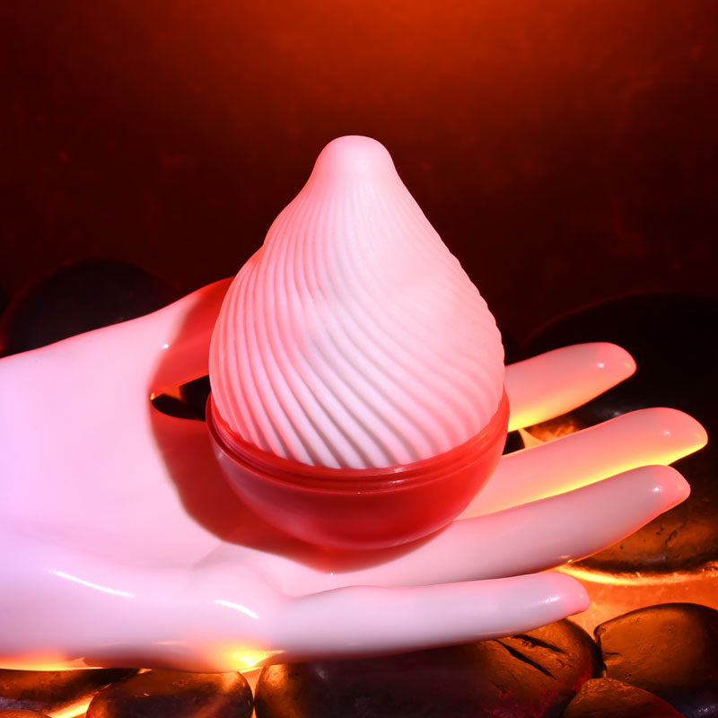 Zero Tolerance KILAUEA - Mini Stroker Egg held in hand, designed for intimate essentials and ultimate pleasure.