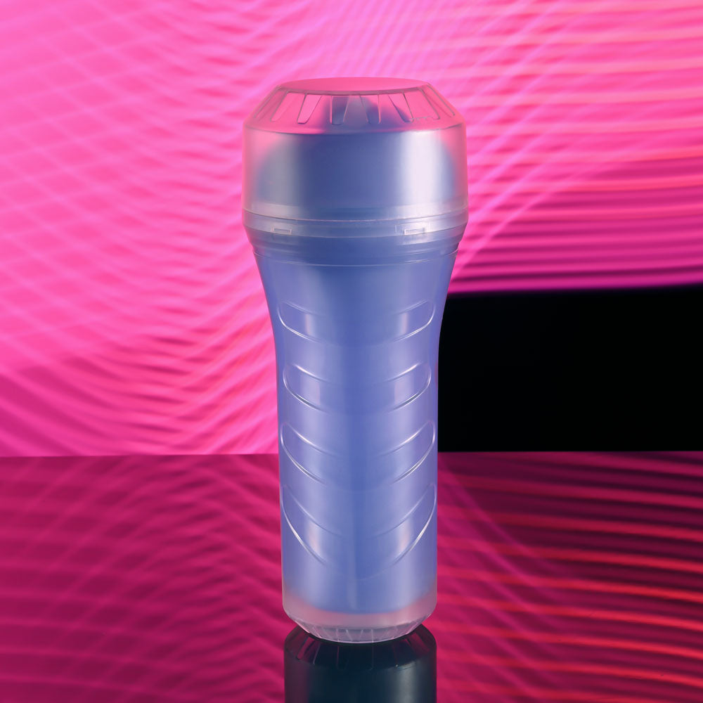 Zero Tolerance POP ON THE GLOW - Glow in Dark Vagina Stroker on a reflective surface with colorful background.