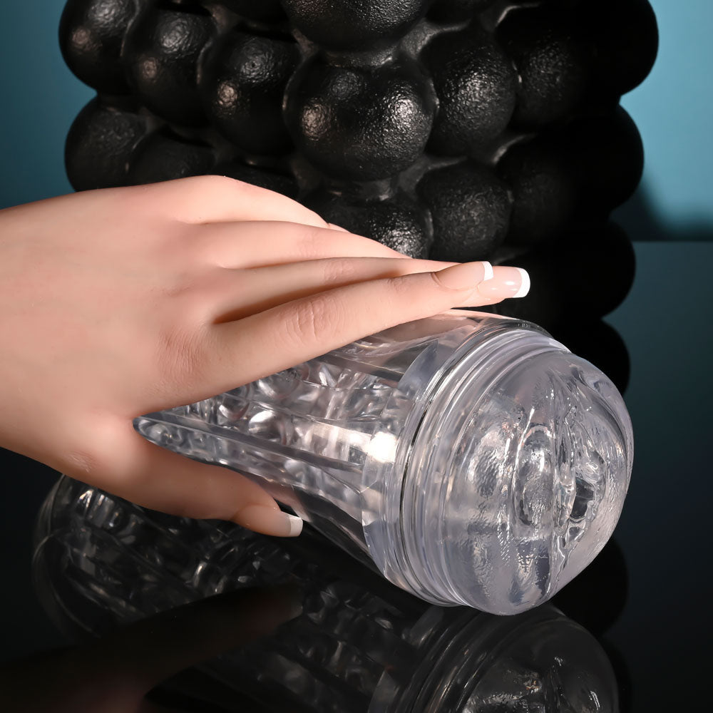 Zero Tolerance CASUAL ENCOUNTER -  Vagina Stroker held in a hand, showcasing its beaded inner channel and easy grip design.