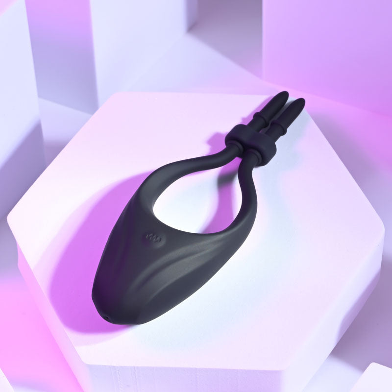 Zero Tolerance PERFECT FIT -  USB Rechargeable Vibrating Lasso Cock Ring on a geometric background.