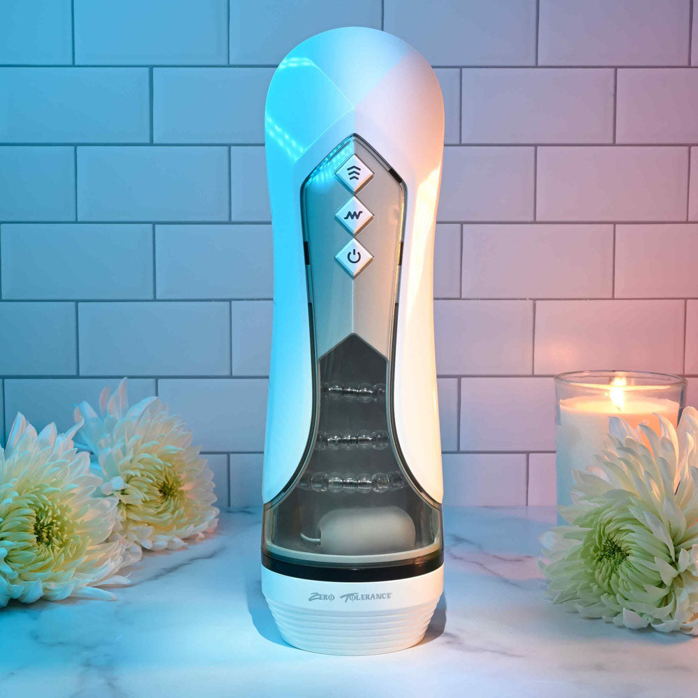 Zero Tolerance STROKING BUDDY - USB Rechargeable Vibrating & Thrusting Stroker with soft inner sleeve and control buttons.