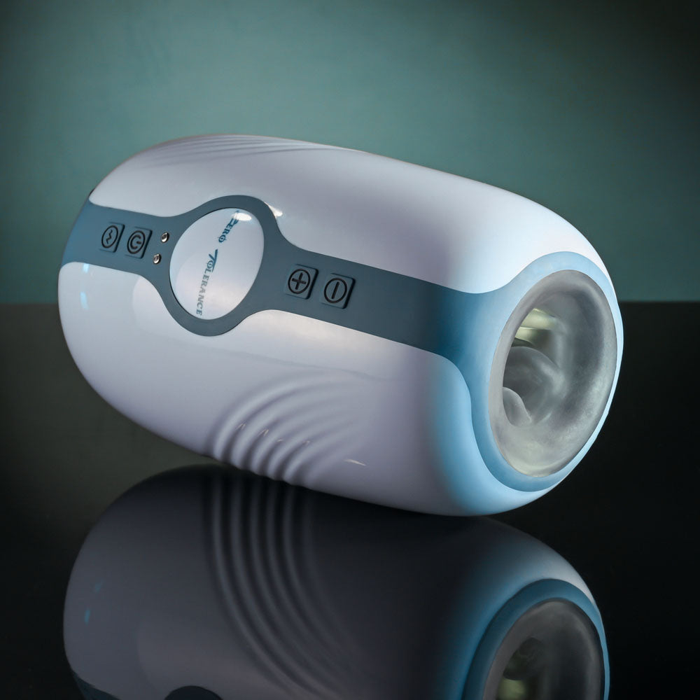 Zero Tolerance TOUCHDOWN - 15 cm USB Rechargeable Vibrating & Tightening Stroker on a reflective surface.
