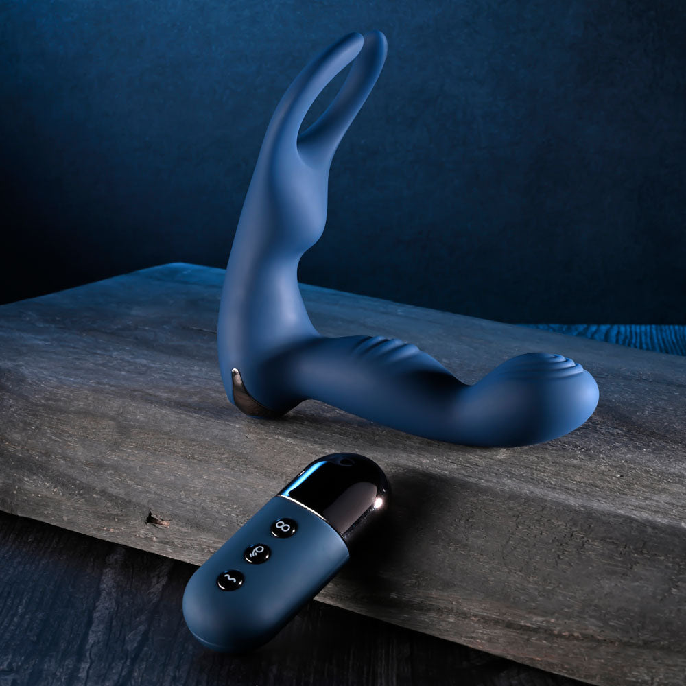 Zero Tolerance BY ALL MEANS -  13.4 cm USB Rechargeable Prostate Massager with Cock Ring on a wooden surface.