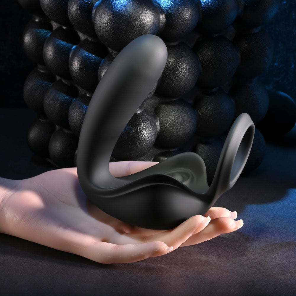Zero Tolerance BALLIN OUT -  USB Rechargeable Prostate Massager with Cock Ring and Wireless Remote held in hand.