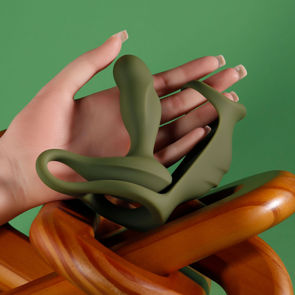 Zero Tolerance PROSTATE POWER PACK -  USB Rechargeable Vibrating Prostate Massager with Cock Ring Harness in hand.