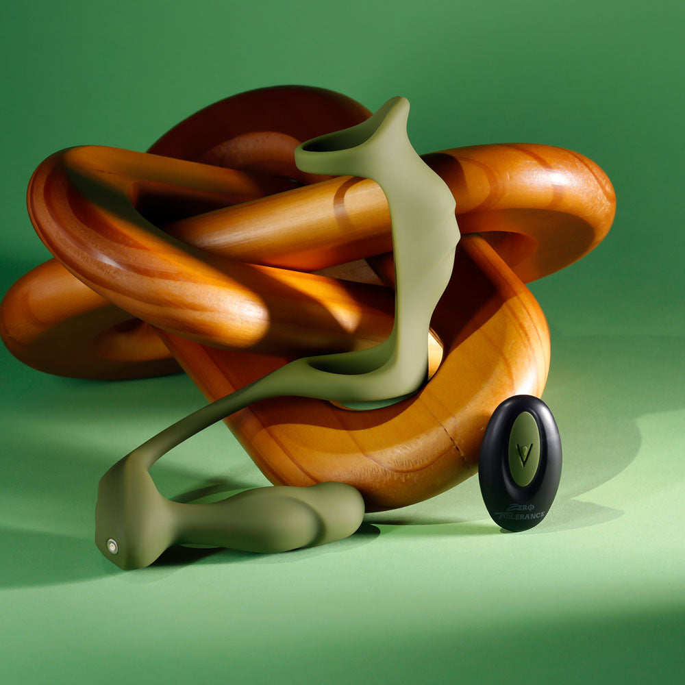 Zero Tolerance PROSTATE POWER PACK -  USB Rechargeable Vibrating Prostate Massager with Cock Ring Harness on a green background.