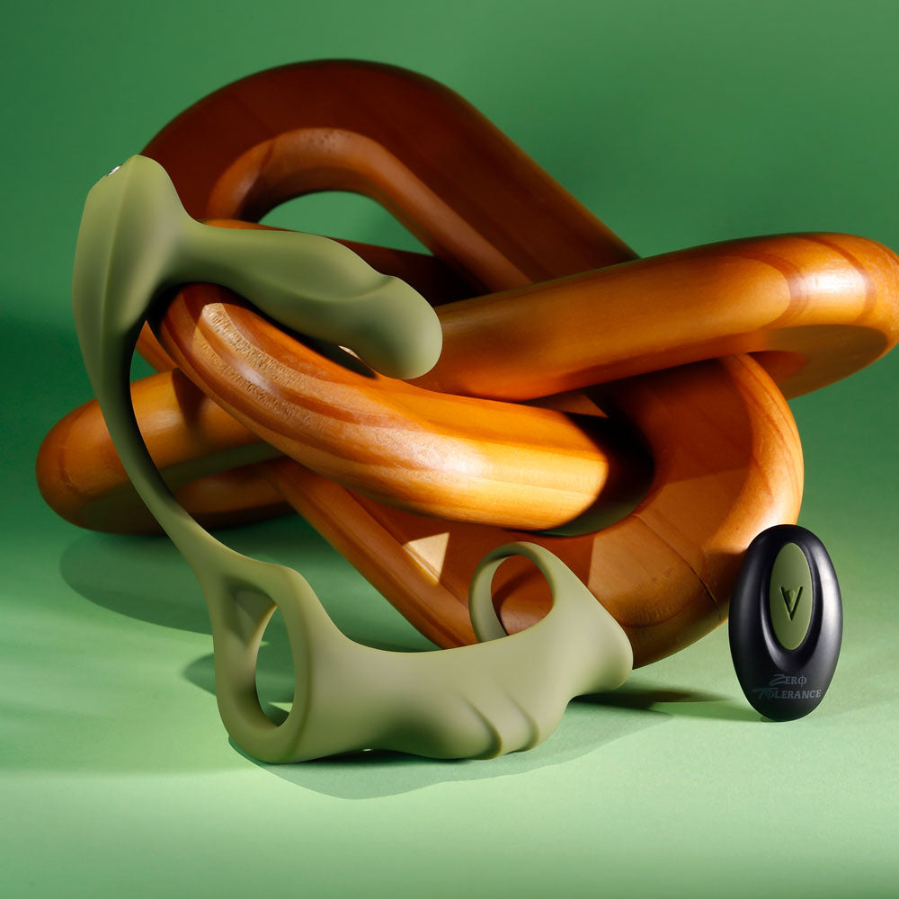 Zero Tolerance PROSTATE POWER PACK -  USB Rechargeable Vibrating Prostate Massager with Cock Ring Harness against a green background.