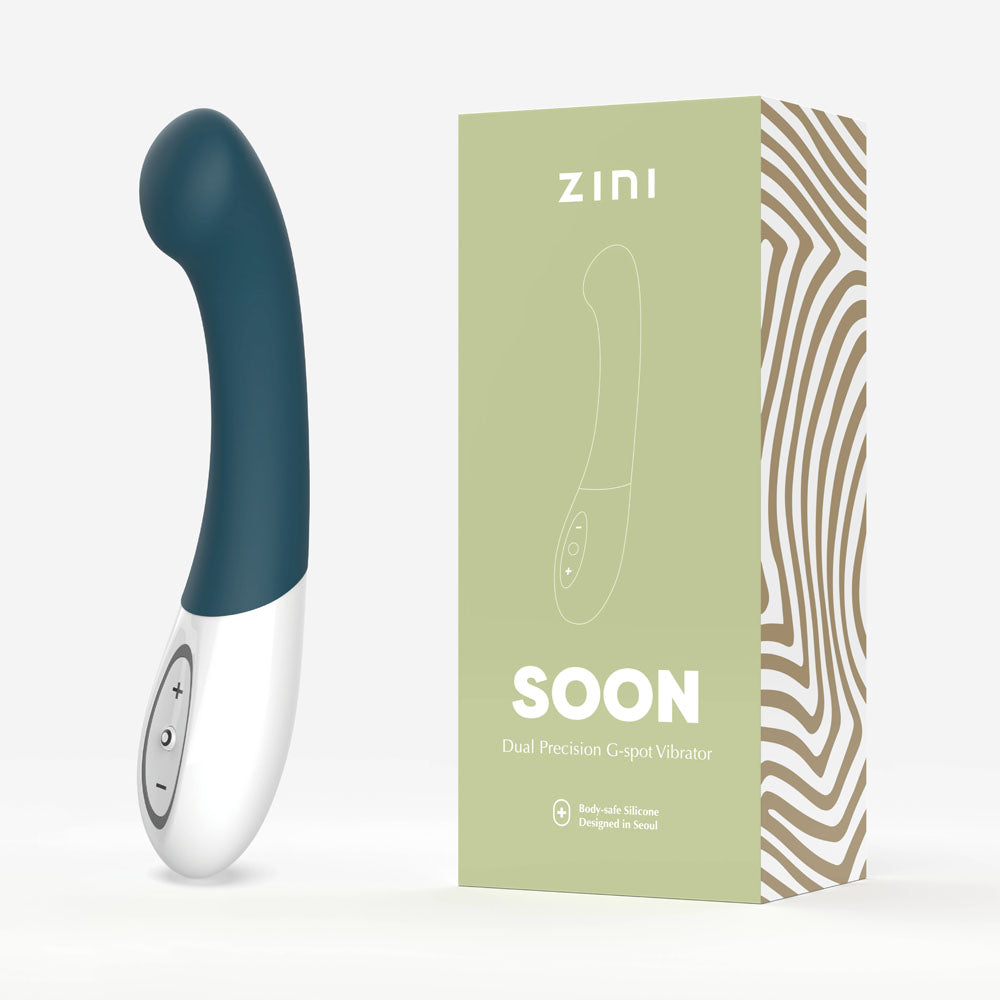 Zini Soon - Legion 20 cm USB Rechargeable Vibrator next to its packaging, showcasing its curved design for intimate essentials.